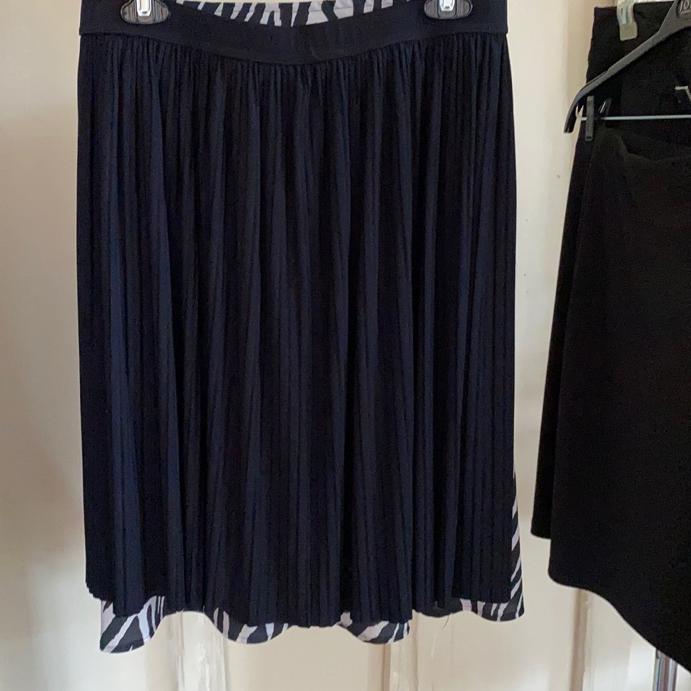 This listing is for 2 skirts.